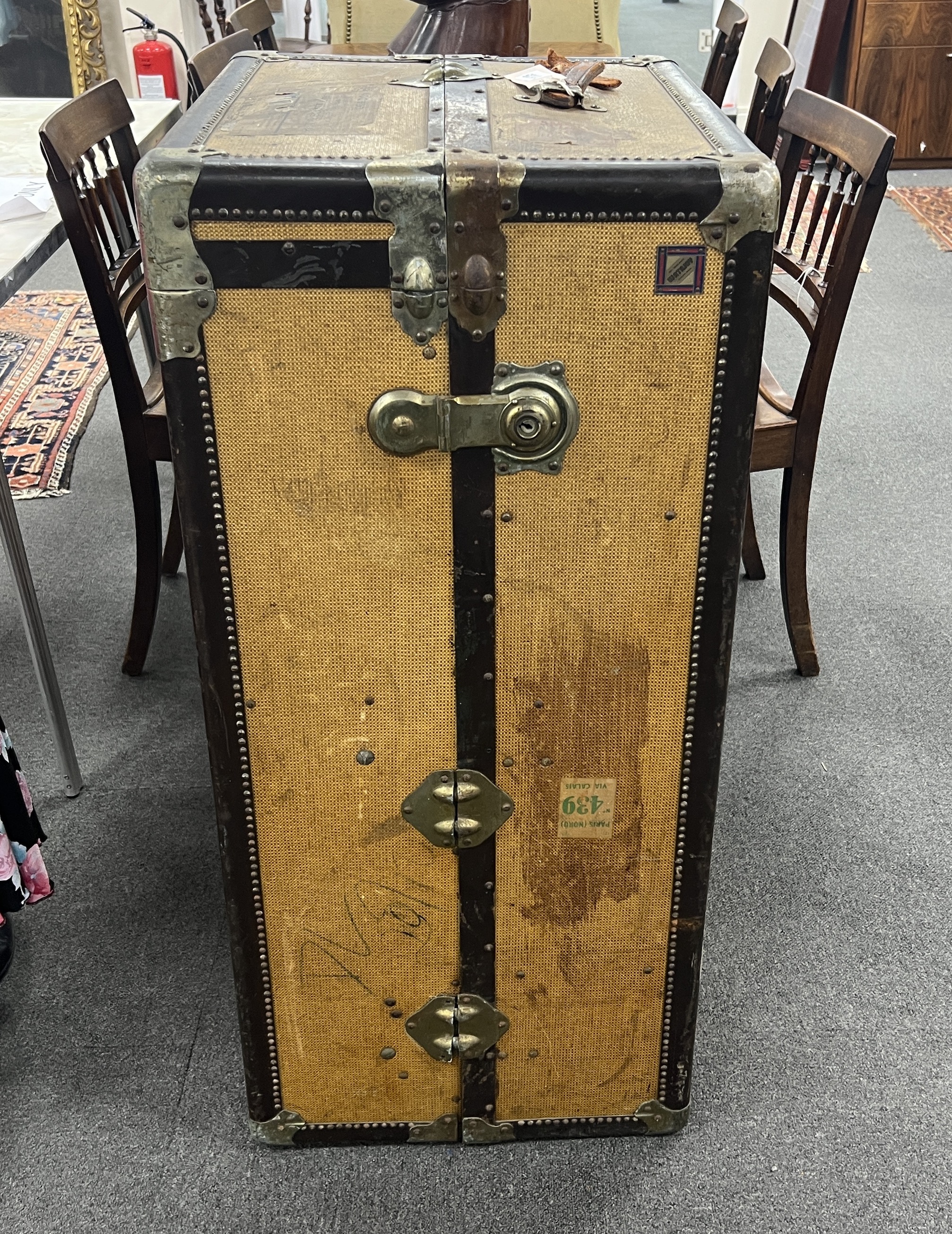 A vintage travelling trunk, (no key) width 103cm, depth 56cm, height 46cm